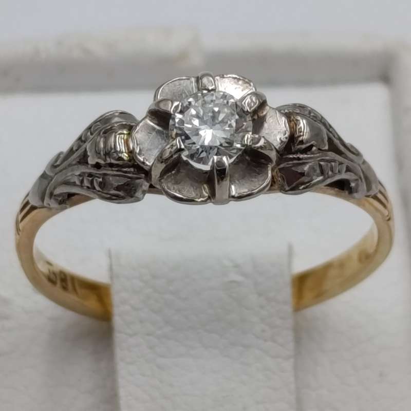 Antique 18kt white and yellow gold ring with a 20 plus pointer diamond