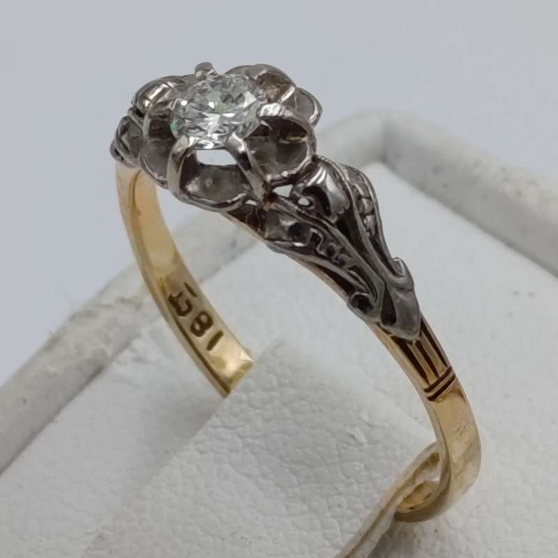 Antique 18kt white and yellow gold ring with a 20 plus pointer diamond
