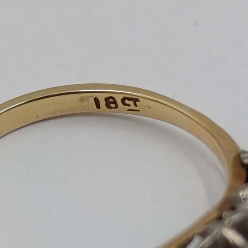 Antique 18kt white and yellow gold ring with a 20 plus pointer diamond