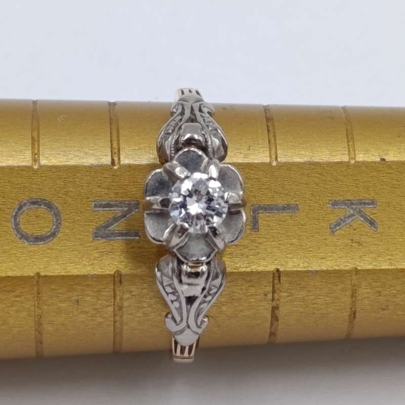 Antique 18kt white and yellow gold ring with a 20 plus pointer diamond