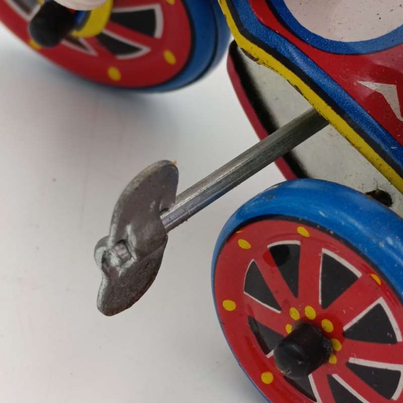 Vintage Tinplate Mechanical Girls tricycle toy in box - working