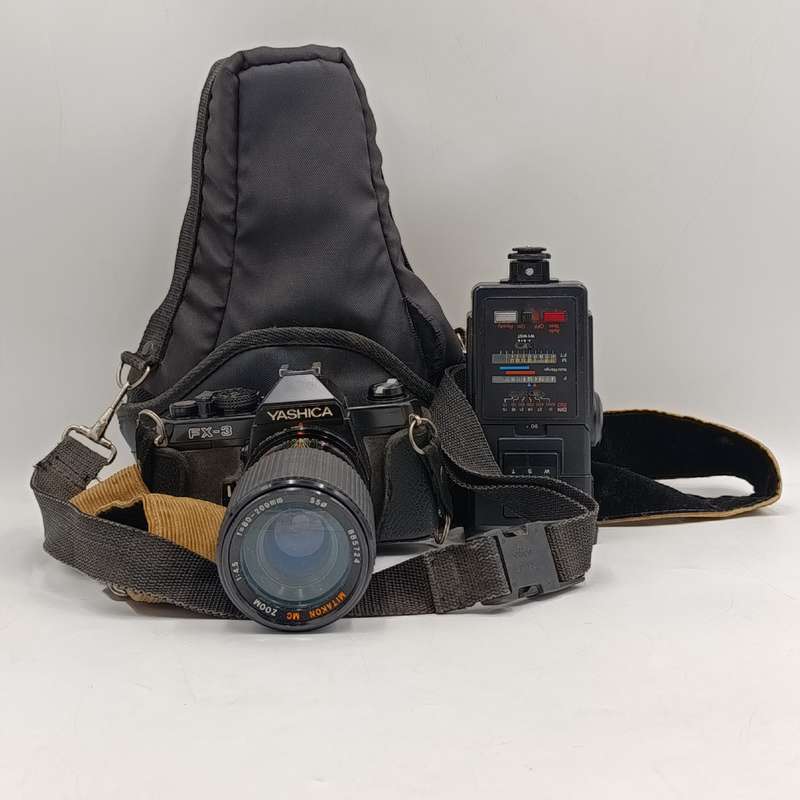 Vintage Yashica FX-3 35mm camera with Hanimex T21 flash in bag - shutter working
