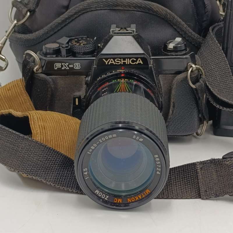 Vintage Yashica FX-3 35mm camera with Hanimex T21 flash in bag - shutter working