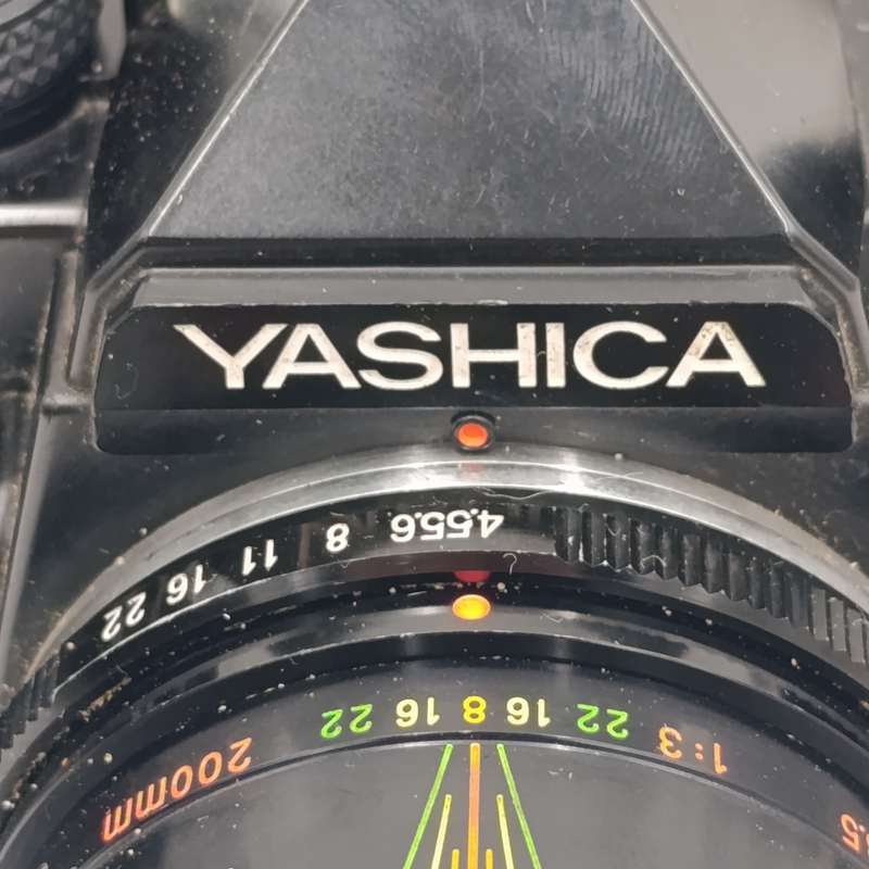 Vintage Yashica FX-3 35mm camera with Hanimex T21 flash in bag - shutter working