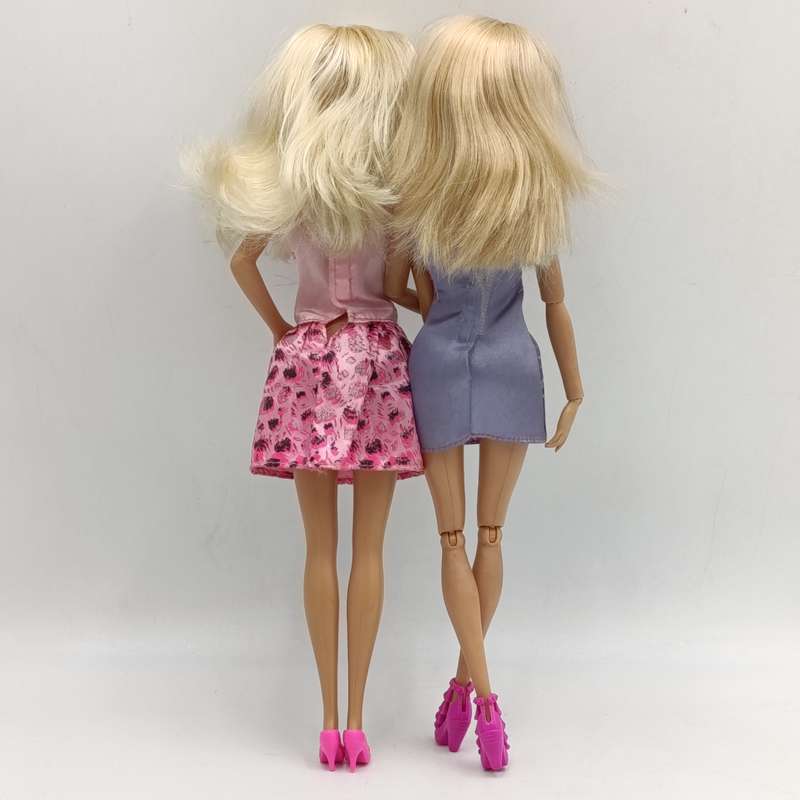 Two dolls fully clothed