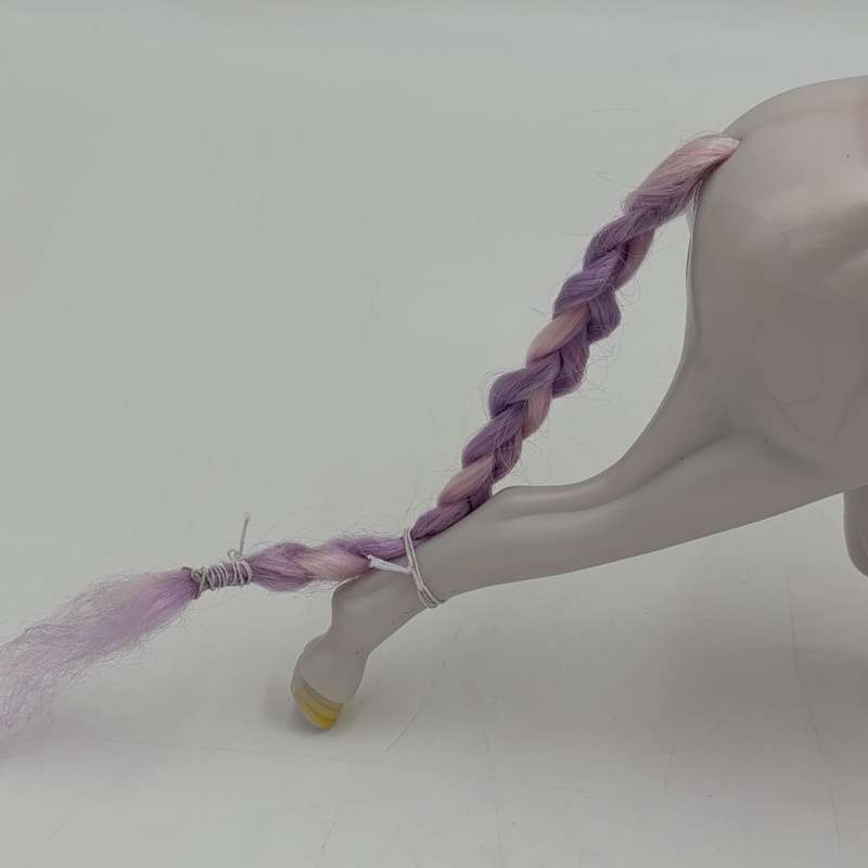 White horse toy with pink saddle