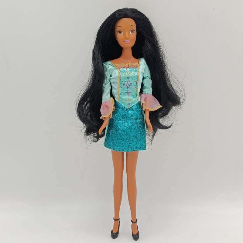 Doll with beautiful black hair and green dress