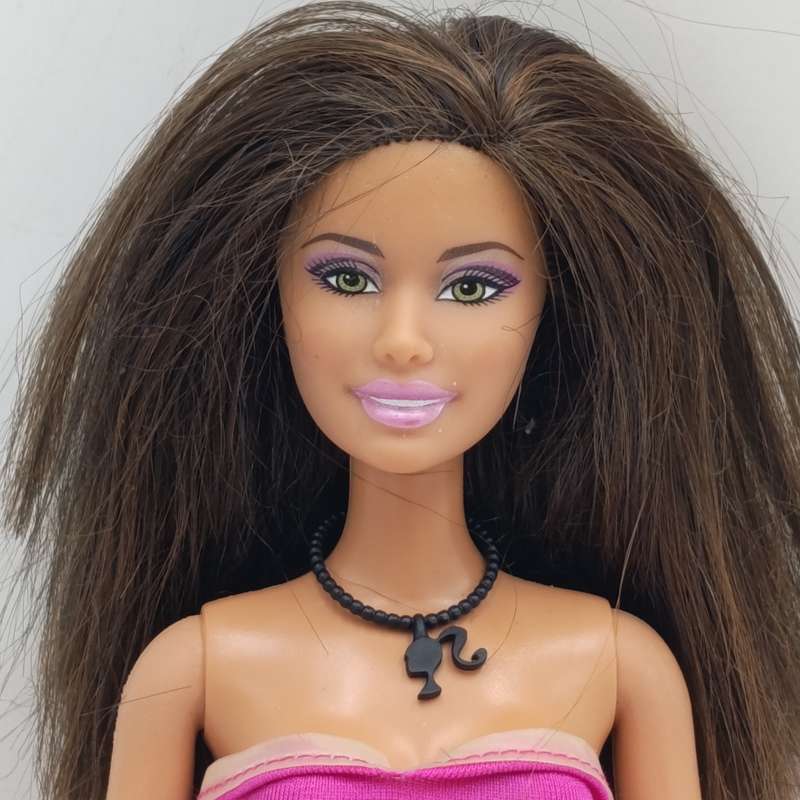 Barbie with pink dress, shoes and necklace