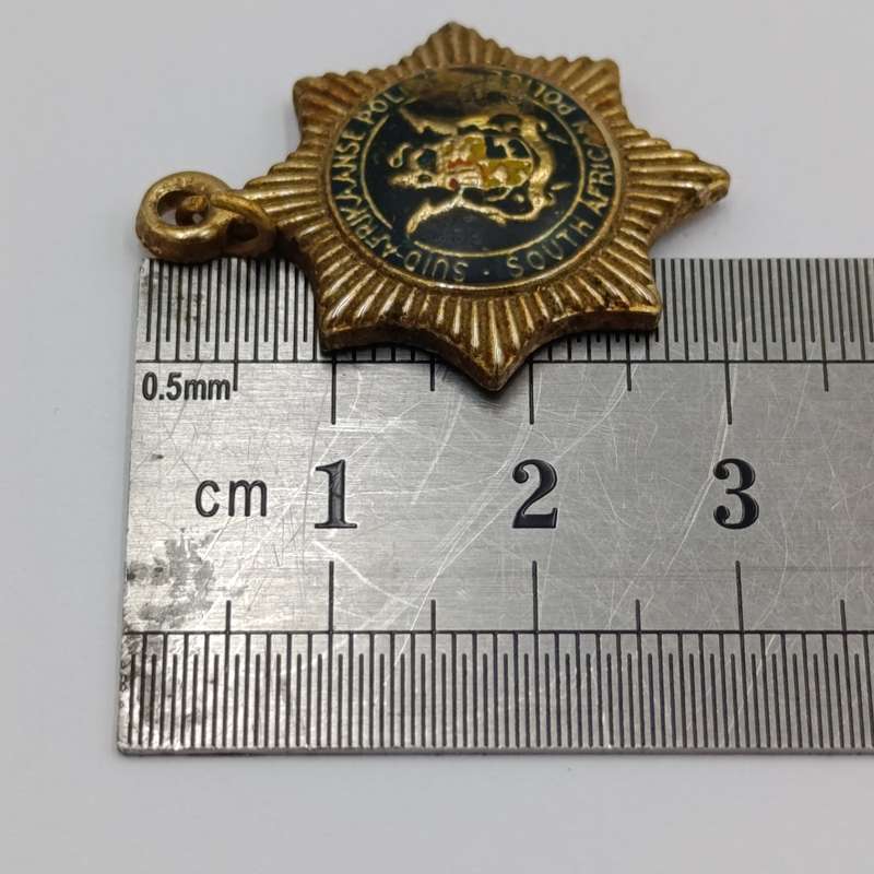 Lot of vintage SA Police pendants and charms