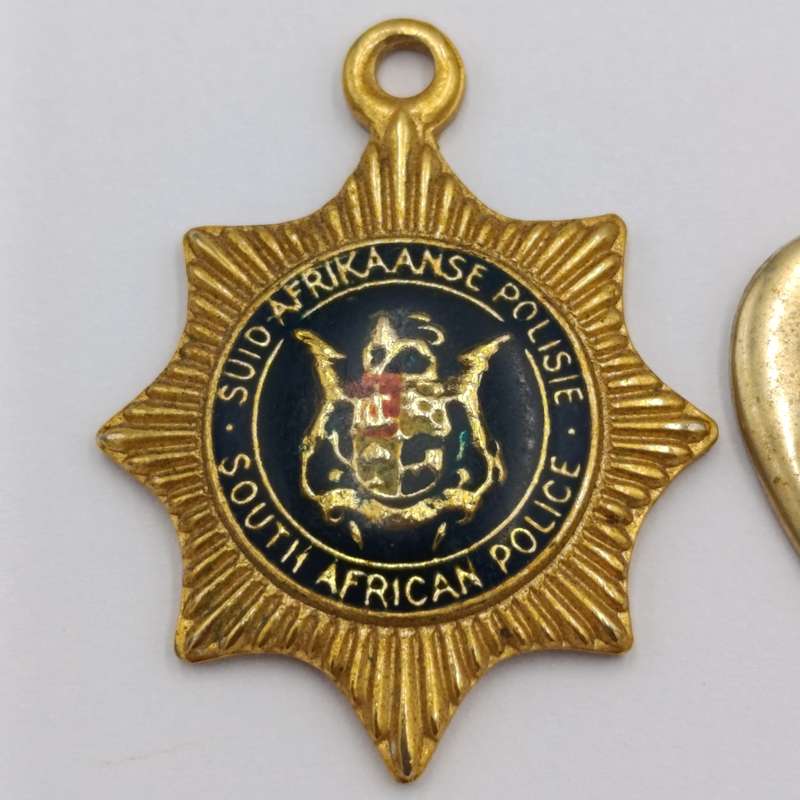 Lot of vintage SA Police pendants and charms