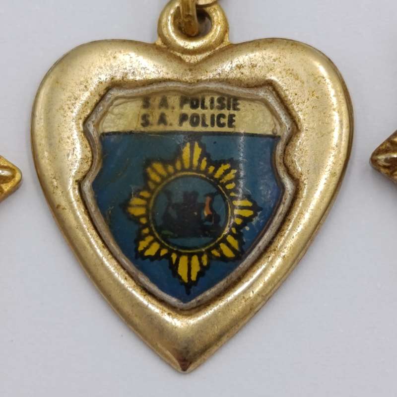Lot of vintage SA Police pendants and charms