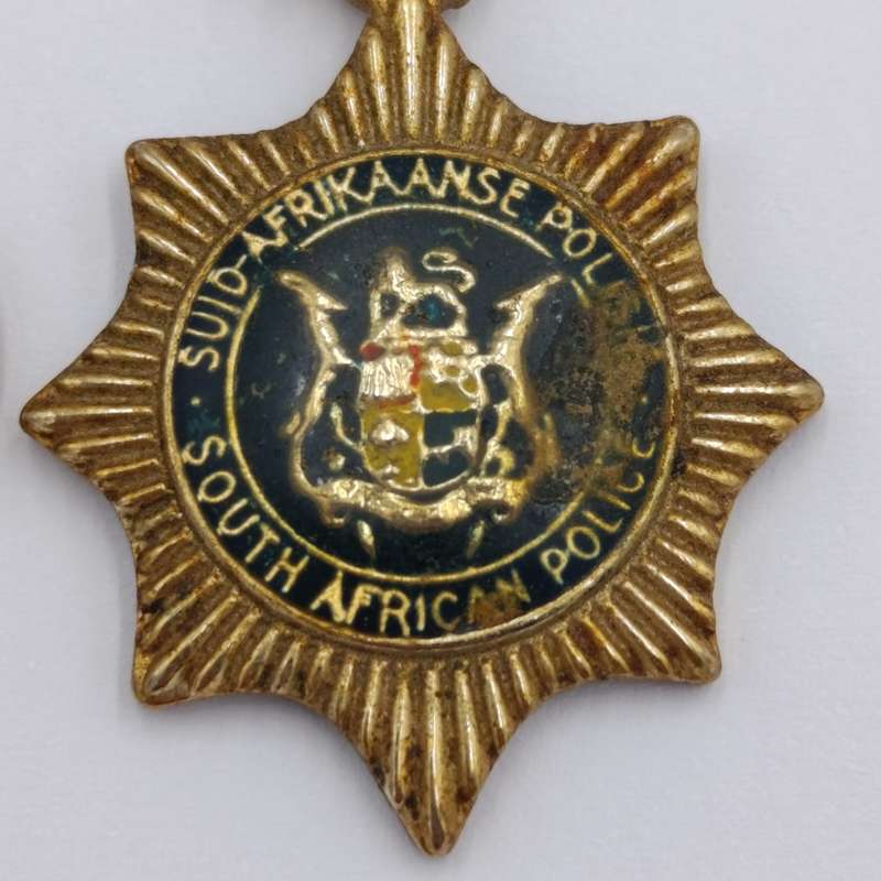 Lot of vintage SA Police pendants and charms