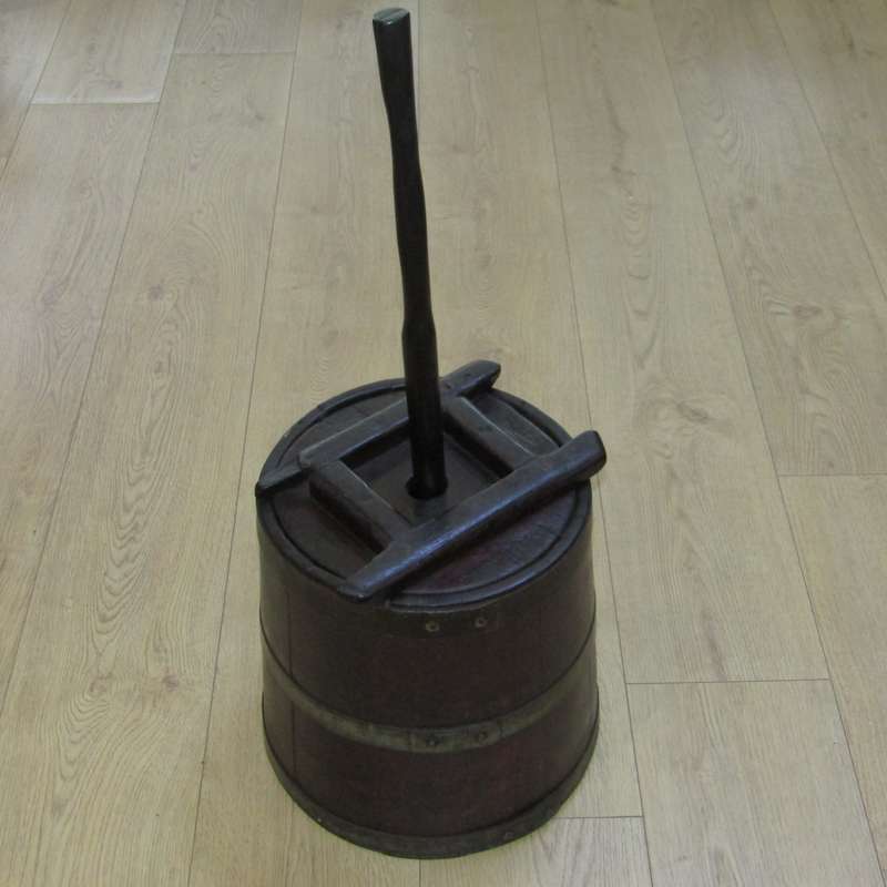 Antique wooden butter churn with stomper