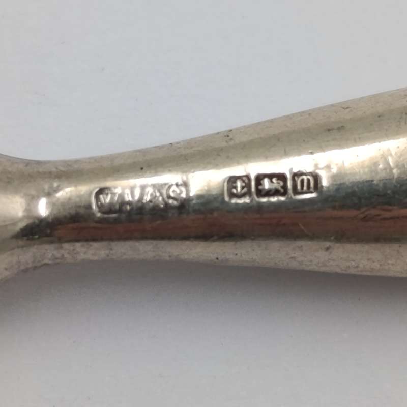 Antique tweezers with hallmarked sterling silver handle