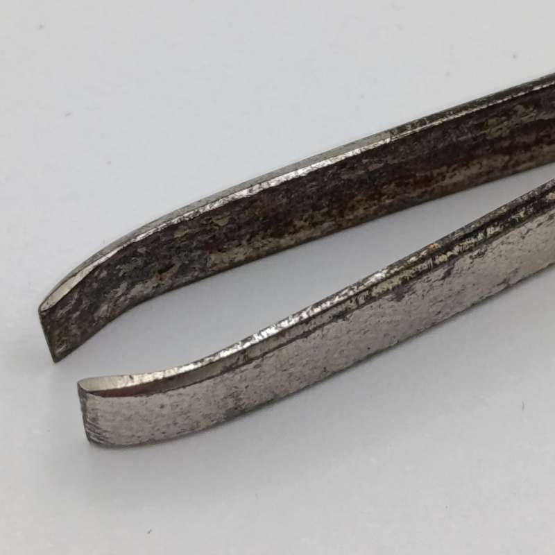Antique tweezers with hallmarked sterling silver handle