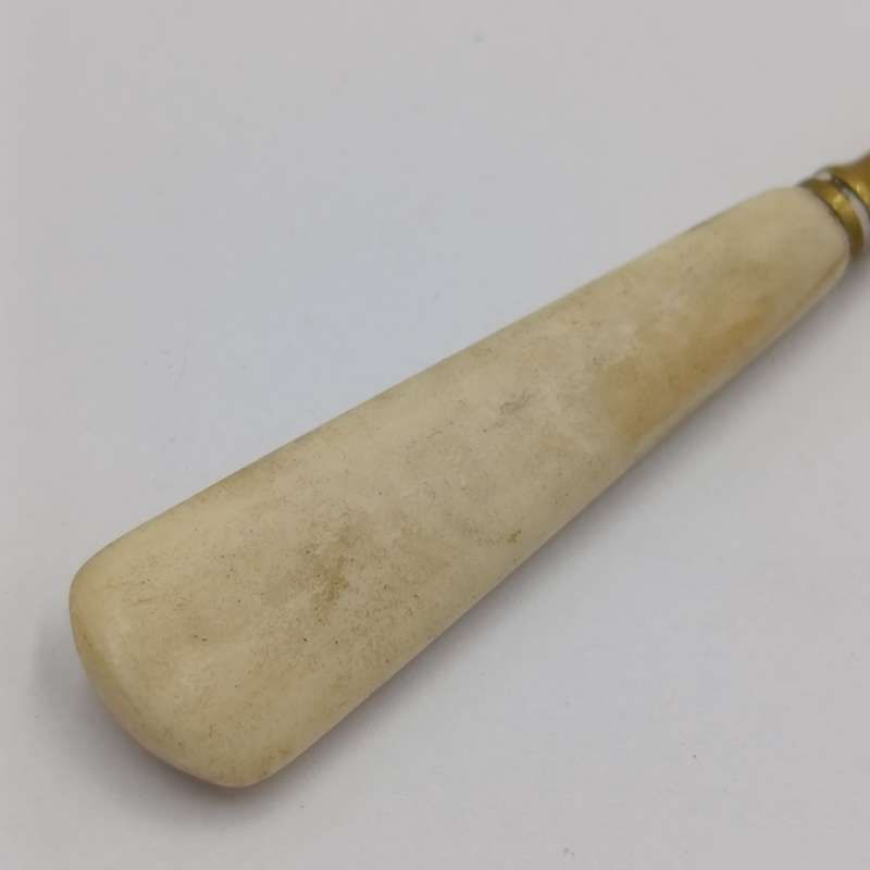 Antique brass bootlace puller with bone handle