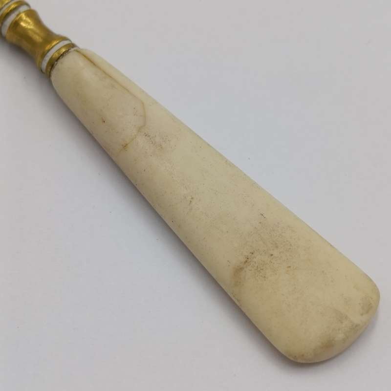 Antique brass bootlace puller with bone handle