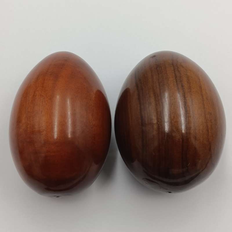 Pair of wooden carved eggs