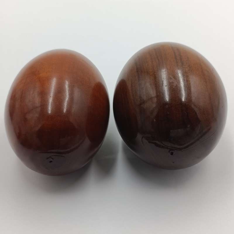 Pair of wooden carved eggs