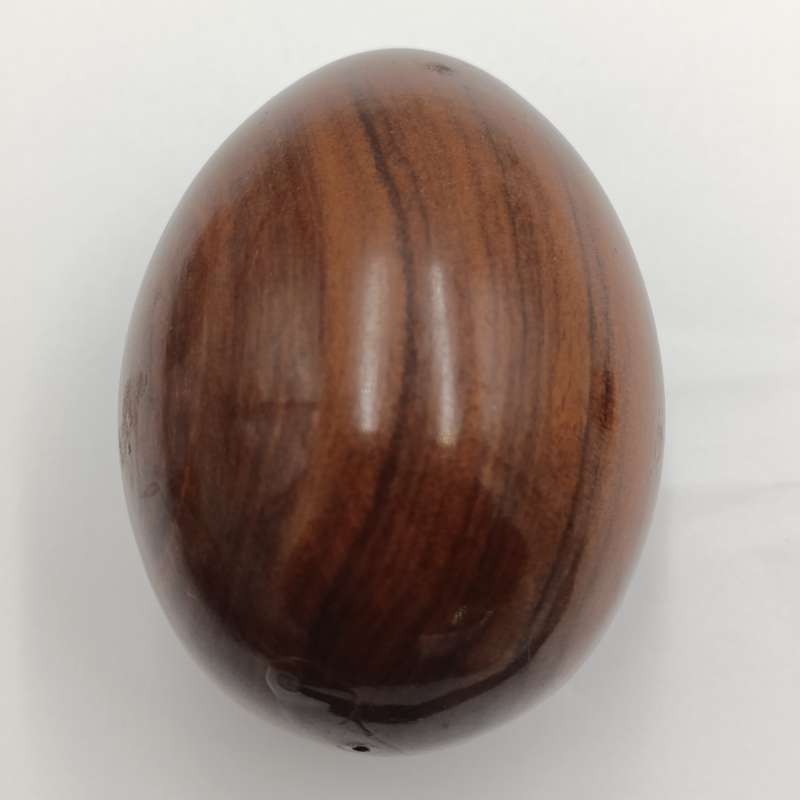 Pair of wooden carved eggs