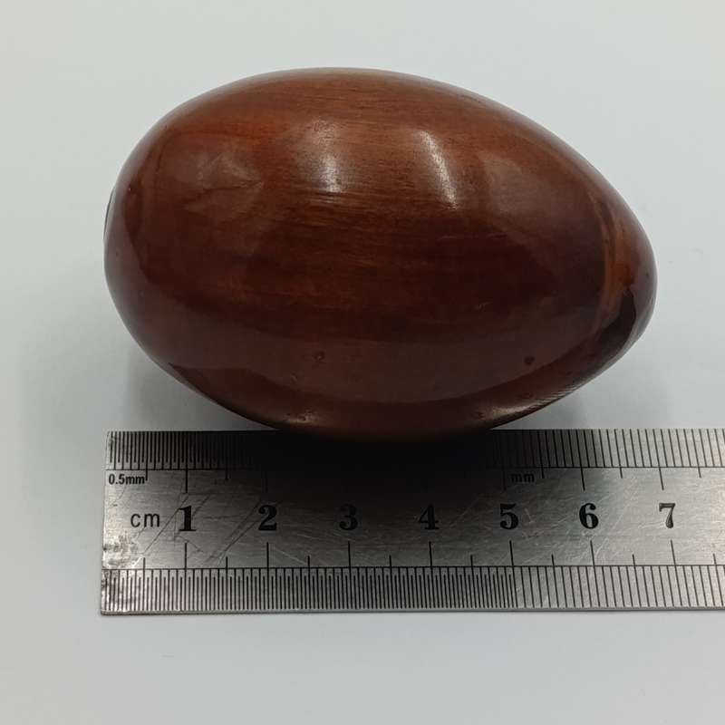 Pair of wooden carved eggs