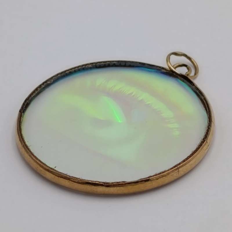Vintage Hologram eye pendant with 9kt Gold surround