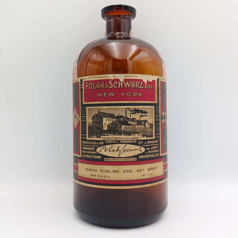 Antique Polak and Schwarz Lemon Sublime Essence casted glass bottle with label