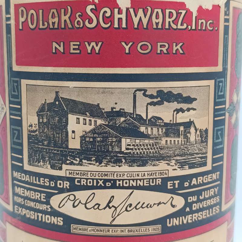 Antique Polak and Schwarz Lemon Sublime Essence casted glass bottle with label