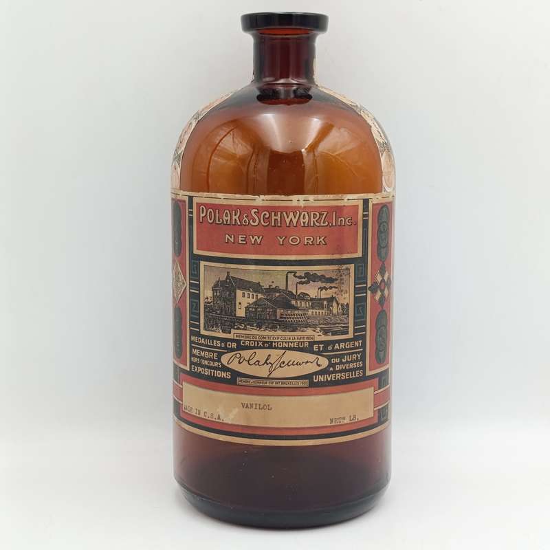 Antique Polak and Schwarz Vanilol casted glass bottle with label