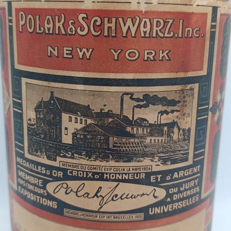 Antique Polak and Schwarz Vanilol casted glass bottle with label