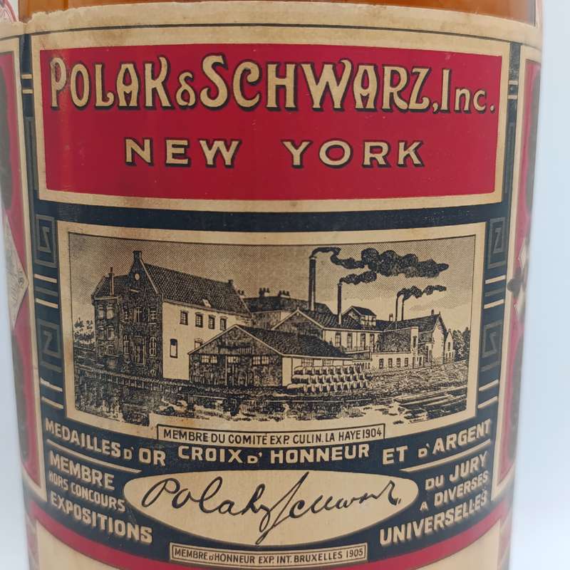 Antique Polak Schwarz Walnut Oil casted glass bottle with label