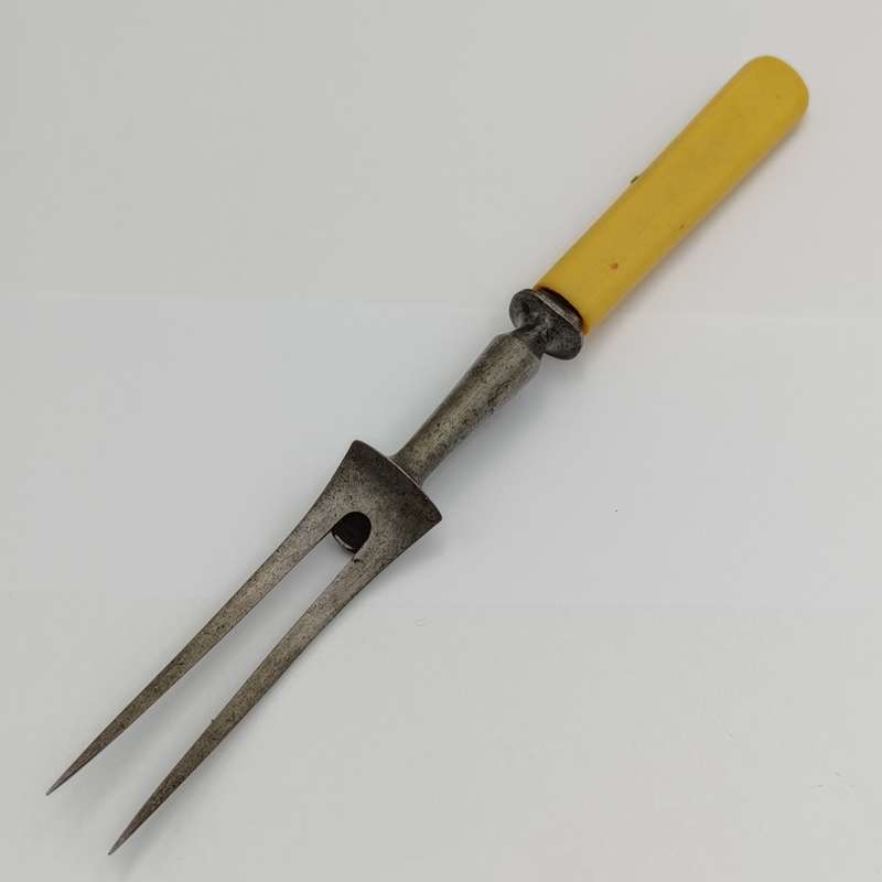 Vintage carving fork and sharpening stick with imitation bone handle