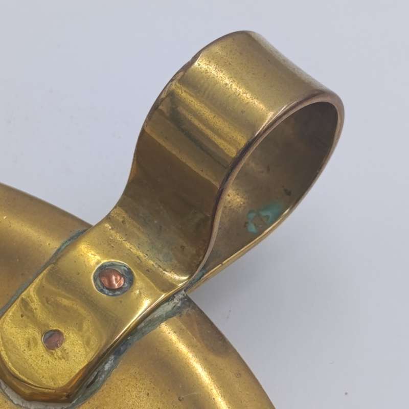 Antique brass candle holder - inscribed at bottom