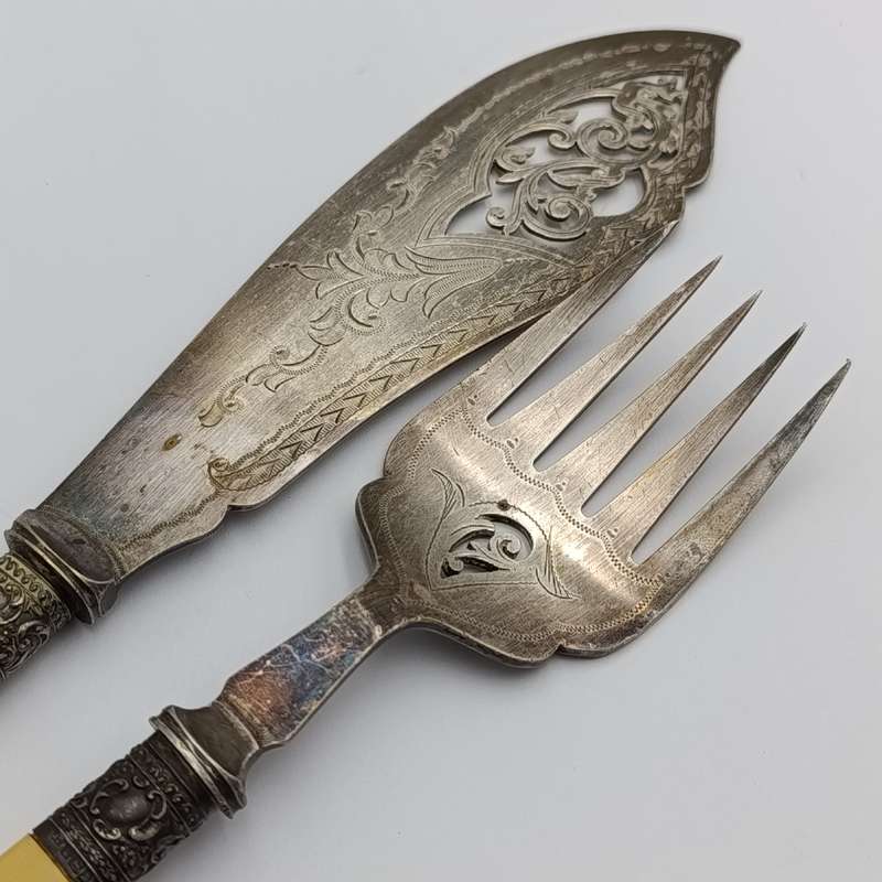 Antique fish serving set with silver trimming with imitation bone handles