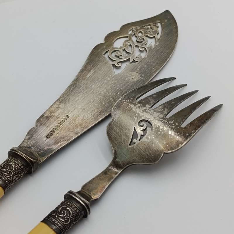 Antique fish serving set with silver trimming with imitation bone handles