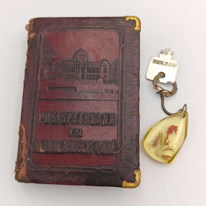Vintage Nederlandsch-Indie postspaarbank book shaped money box with key