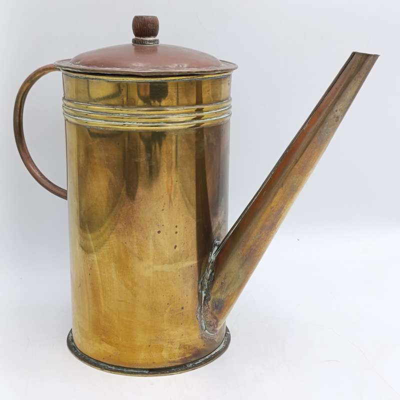 Antique brass watering can
