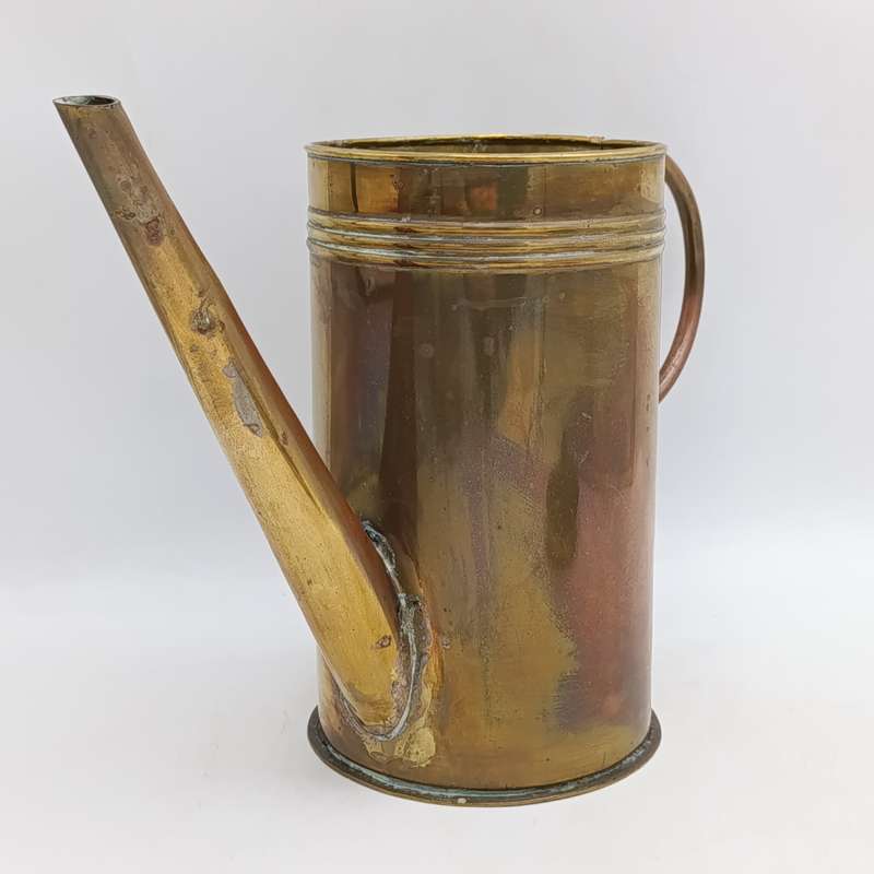 Antique brass watering can