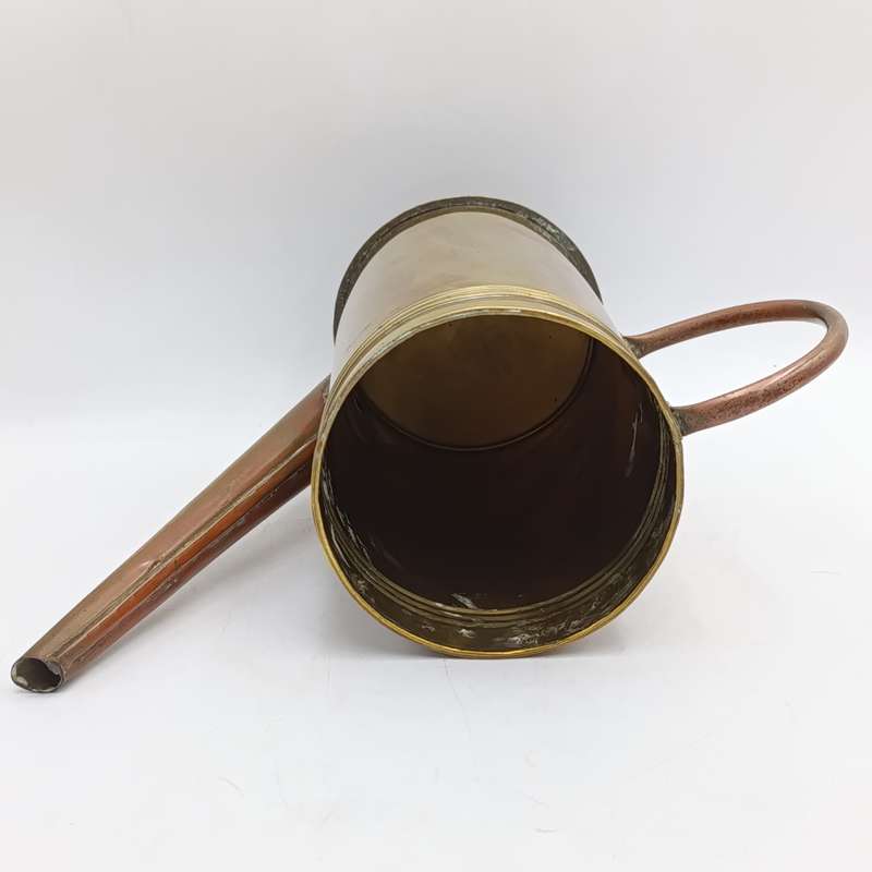 Antique brass watering can