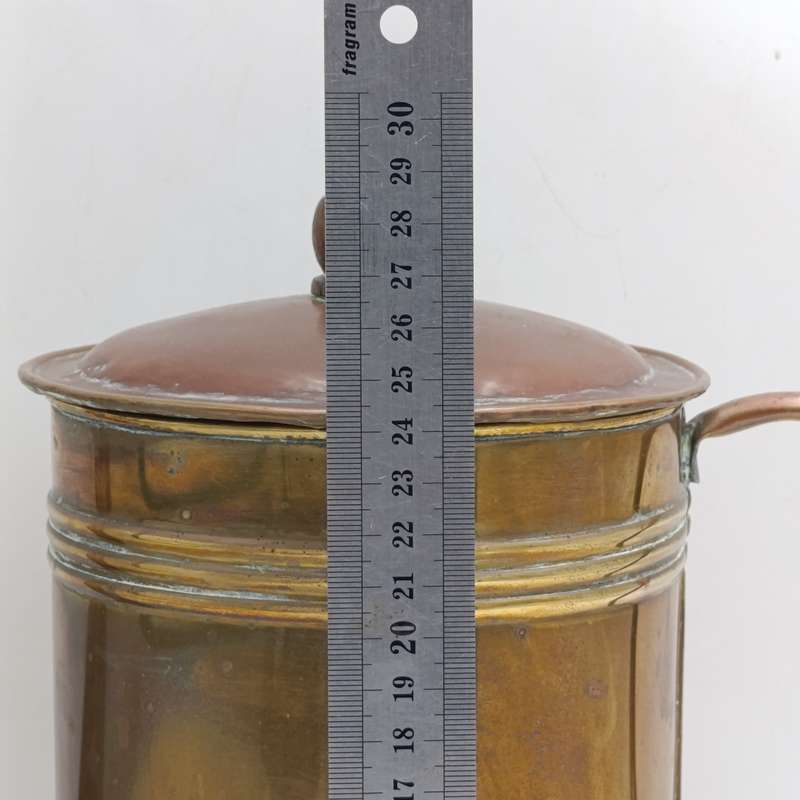 Antique brass watering can