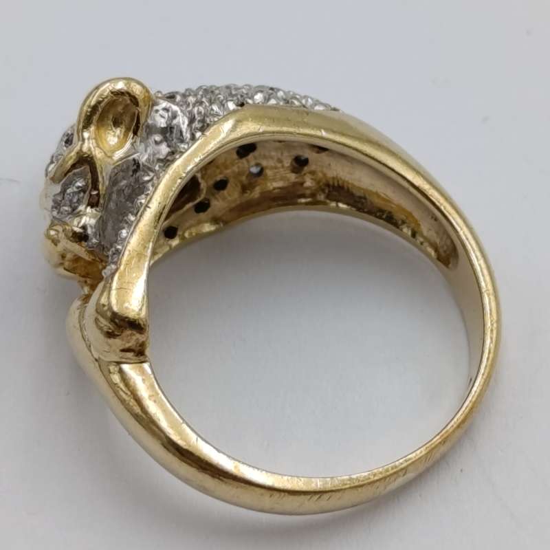 9kt gold predator with a multitude of small diamonds - weight 5.8g