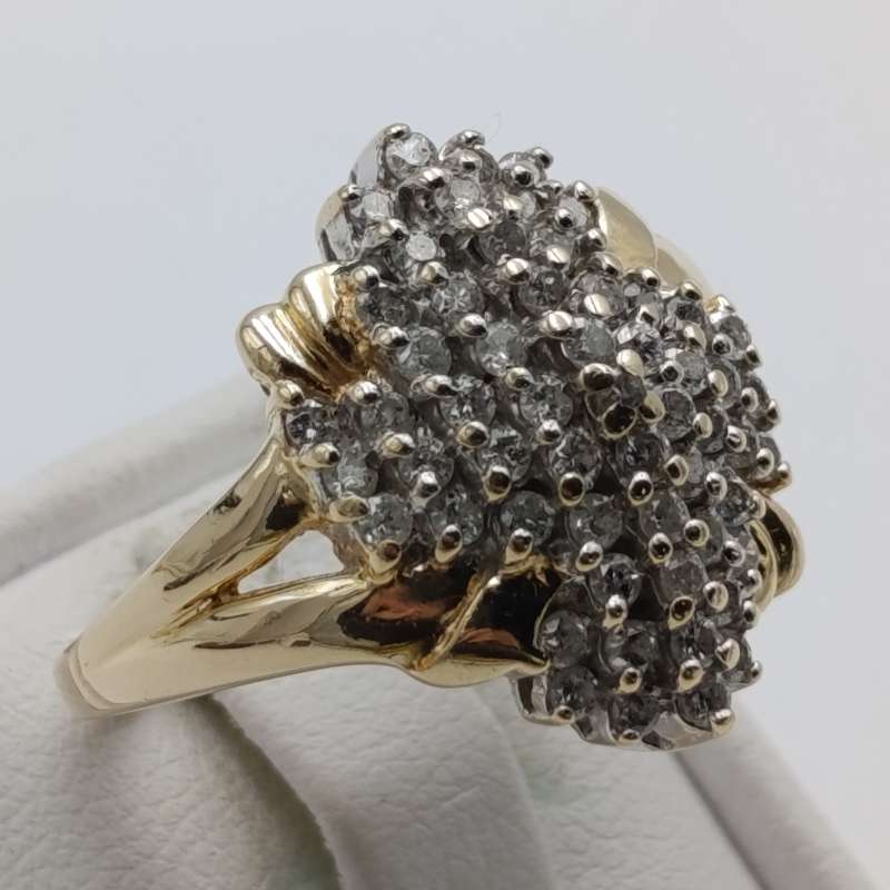 14kt gold ring with 57 diamonds weight 6.3g