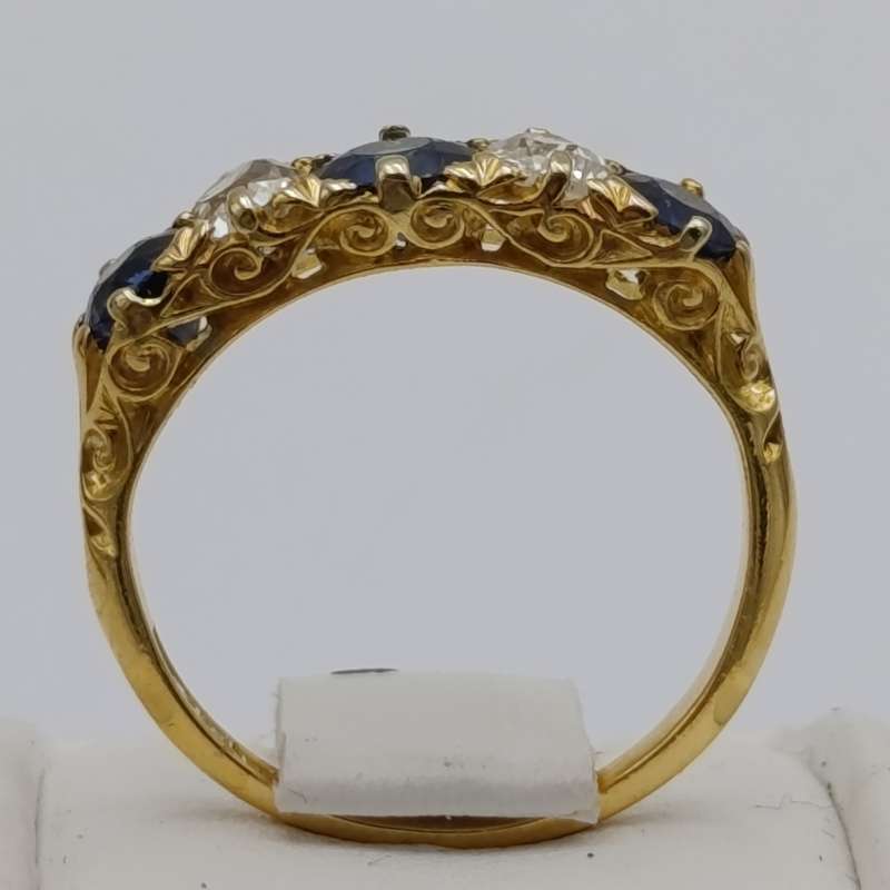 18kt gold ring with 2 diamonds totalling about 40 points and 3 sapphires totalling about 80 points