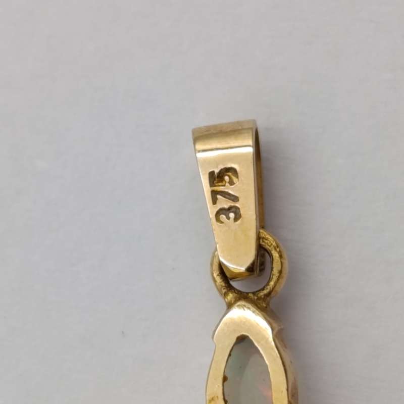 9kt Gold cross pendant with opals and small diamond - weighs 1.3g