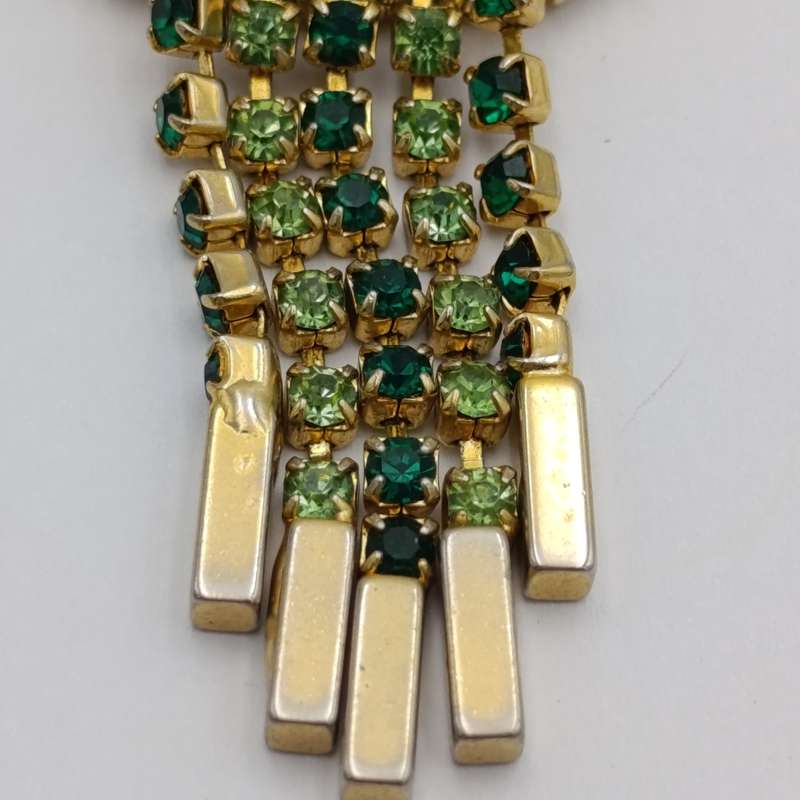 Vintage gold color & green stone brooch