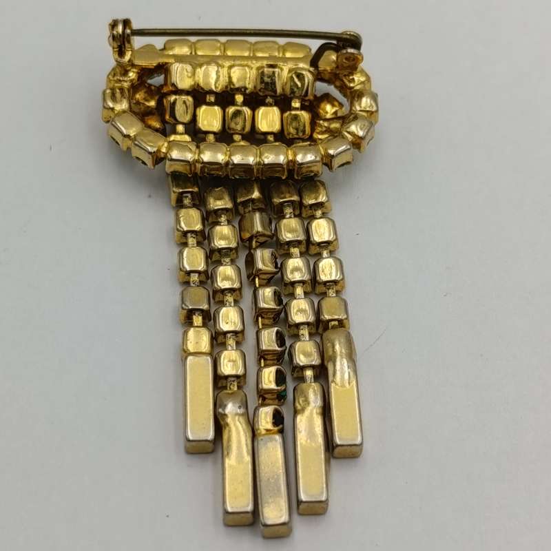 Vintage gold color & green stone brooch