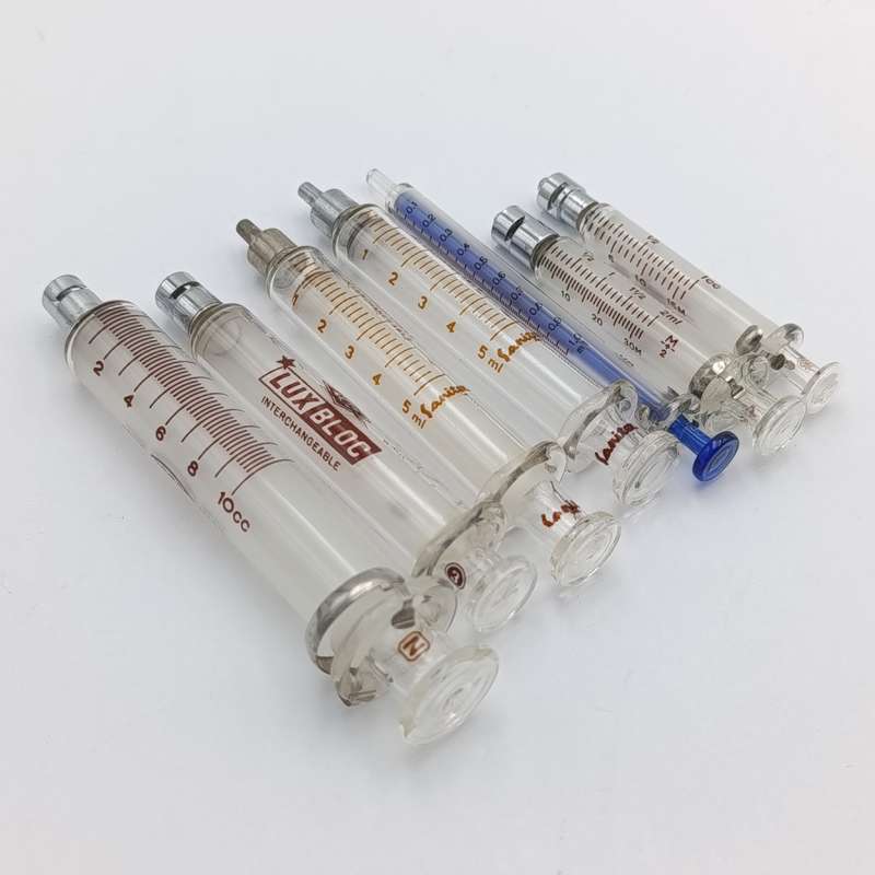 Lot of 7 vintage glass syringes