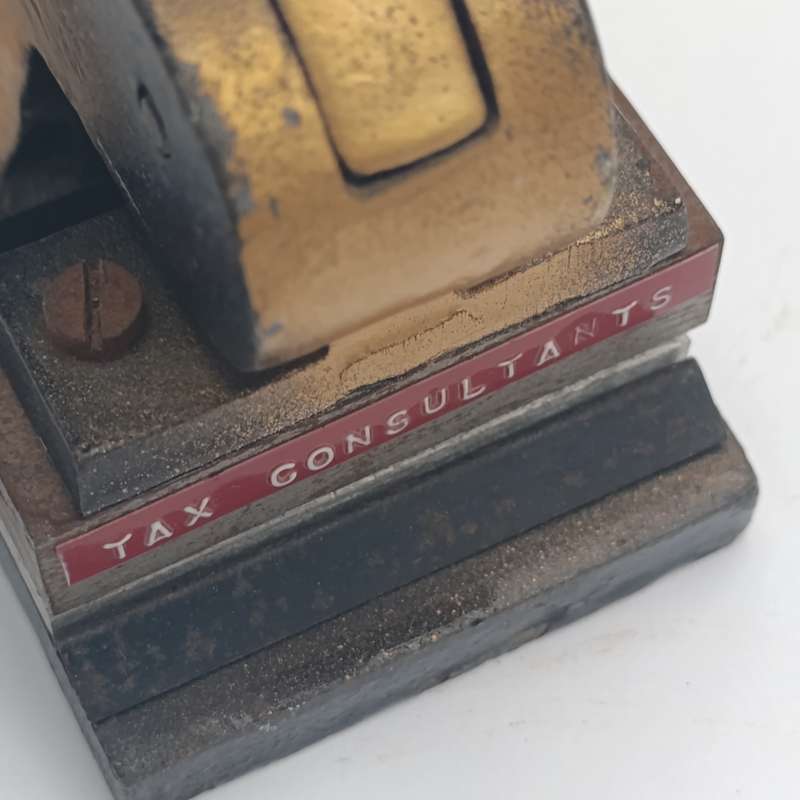 Antique embossing tool for "W.Breytenbach & Co. Tax consultants"