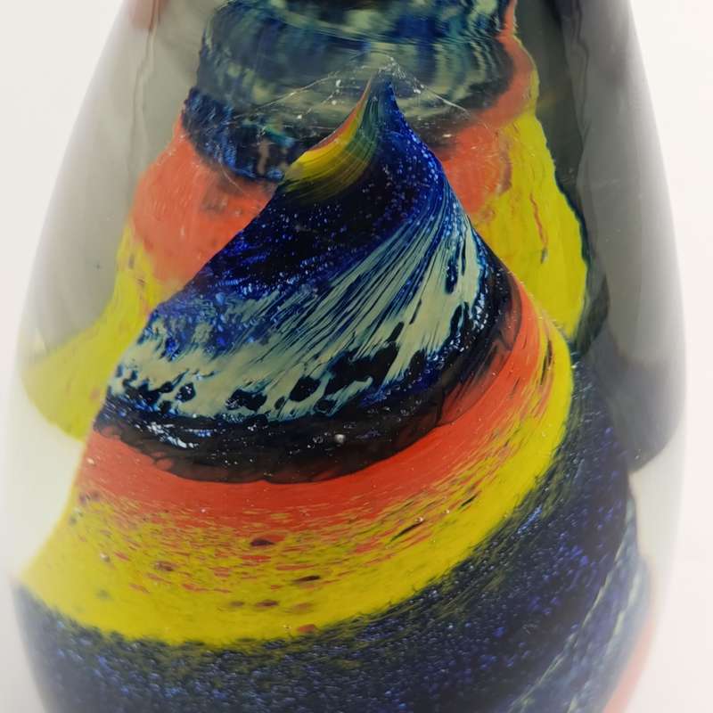 Vintage glass paperweight with colourful spiral
