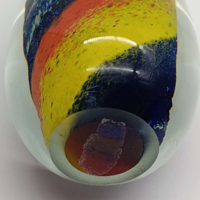 Vintage glass paperweight with colourful spiral